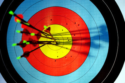 Images of an archery target with arrows and people shooting